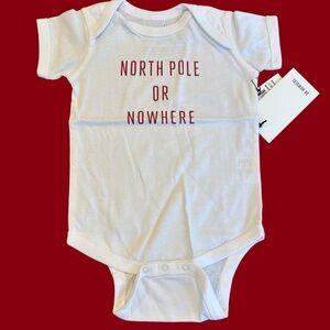 Knowlita 12 mos. One Piece with Red Text: “North Pole or Nowhere”